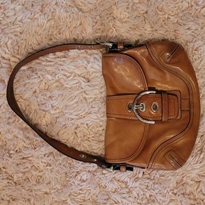 Coach bag with buckle